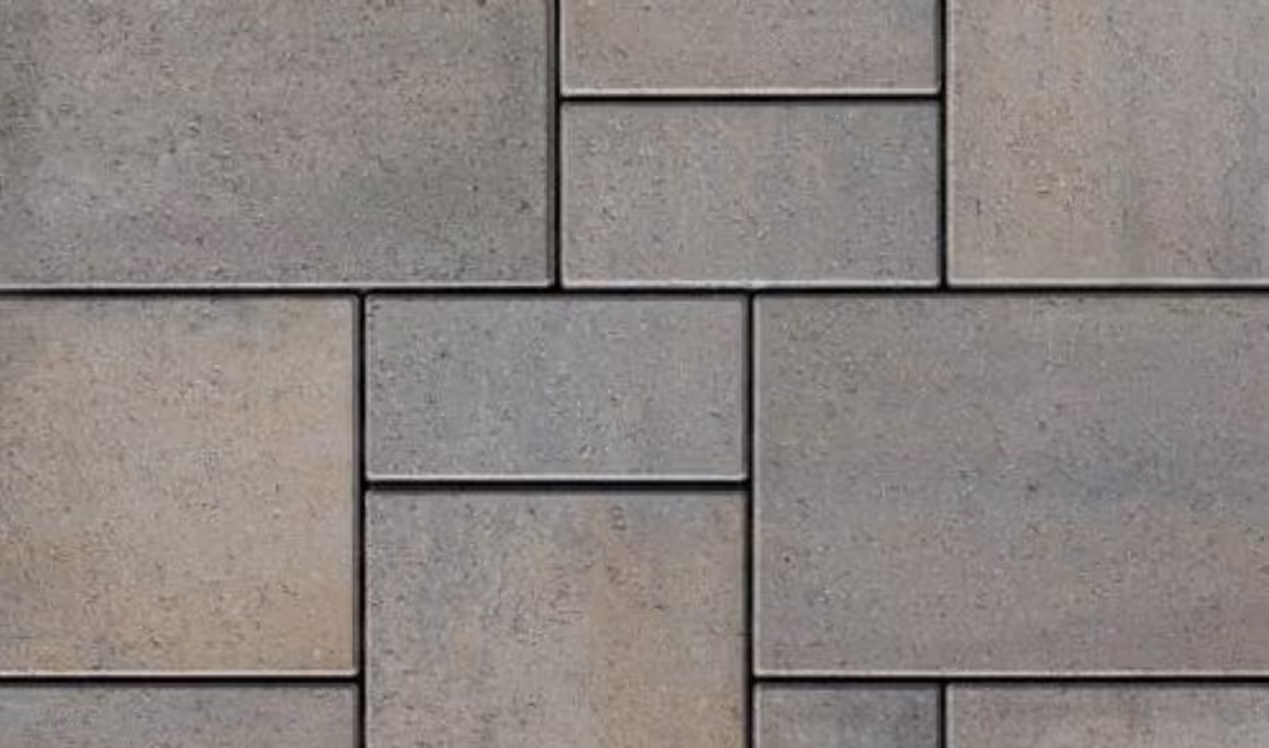 Concrete paver pool deck option surrounding a gunite pool