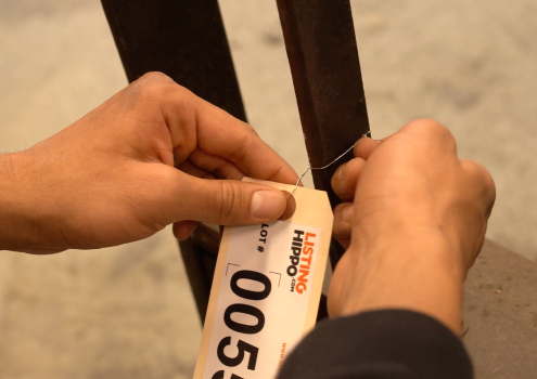 Cataloging industrial equipment to be sold.