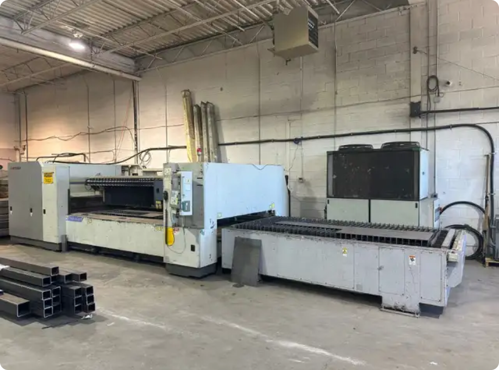 Industrial Equipment being loaded onto a truck which was sold by ListingHippo. The equipment is Used metalworking and fabrication equipment