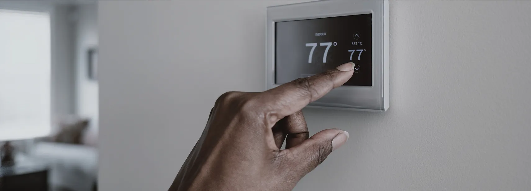 Digital thermostat integrated into MEP systems, enabling precise HVAC control for indoor comfort and efficiency.