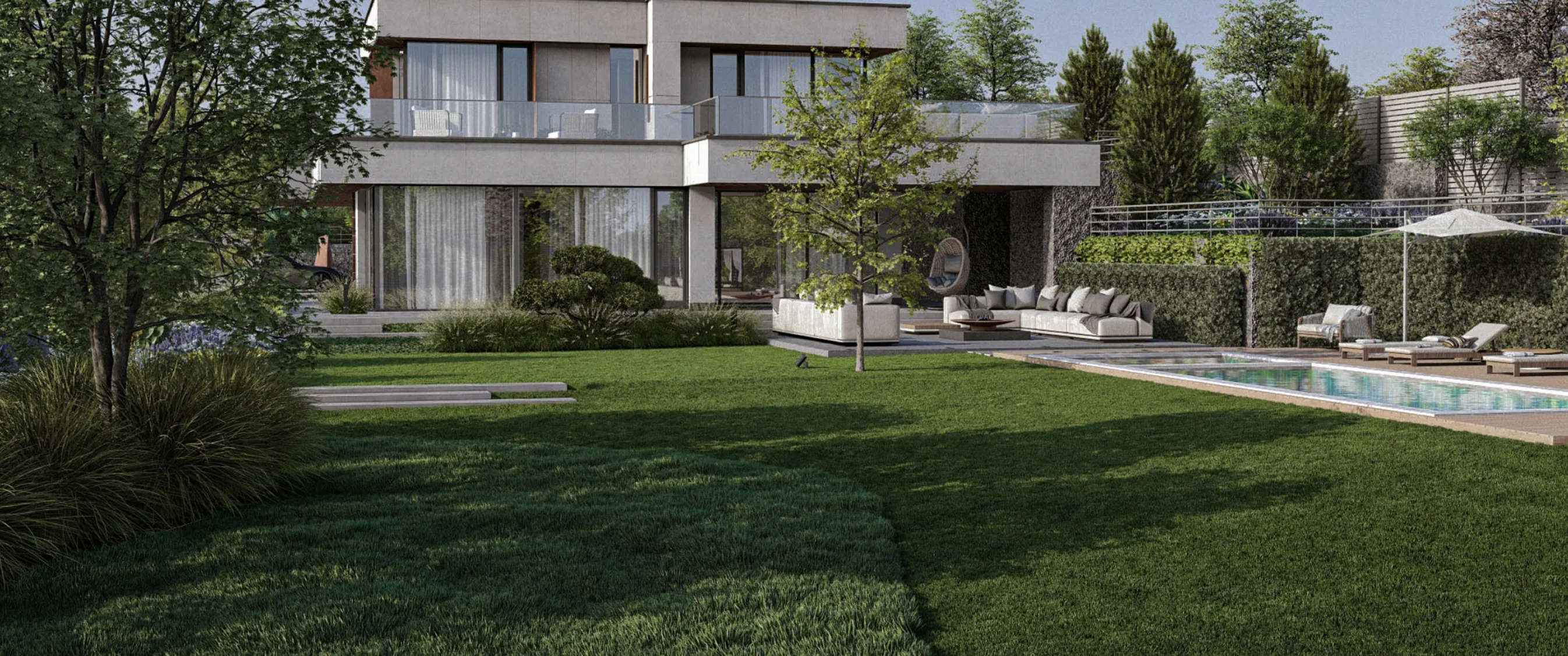 Luxury villa featuring lush green grass and an infinity pool