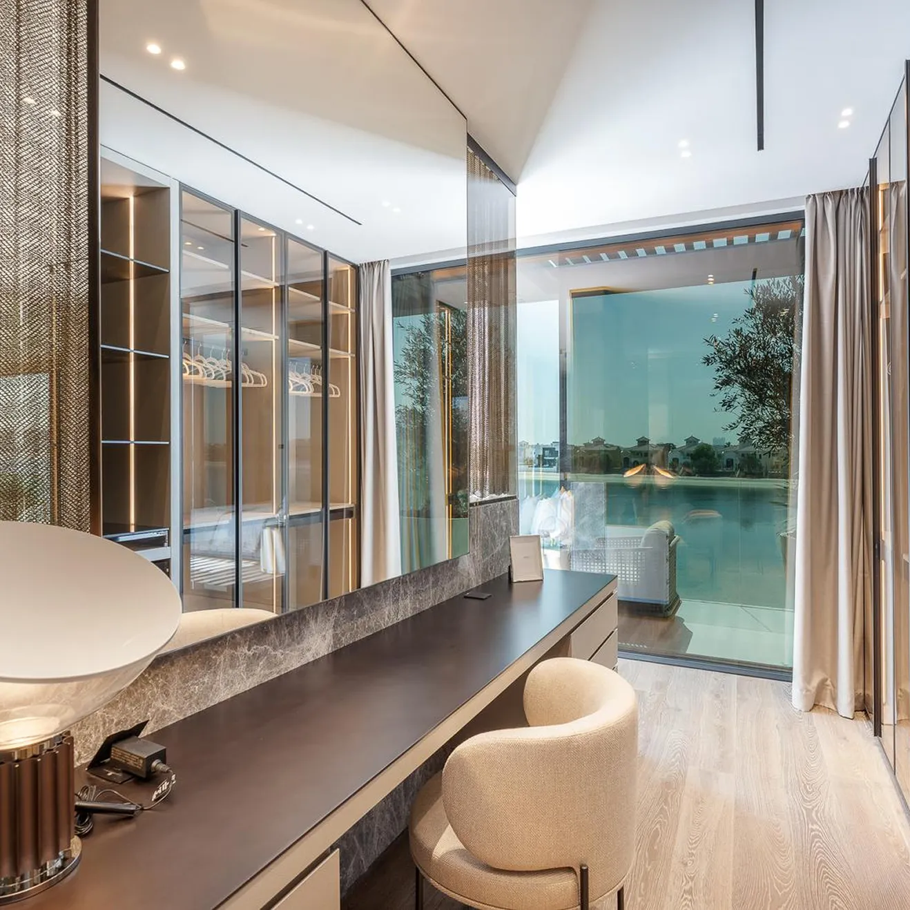 Tailored interior fit out for a bespoke luxury villa bedroom with custom designed walk in closets