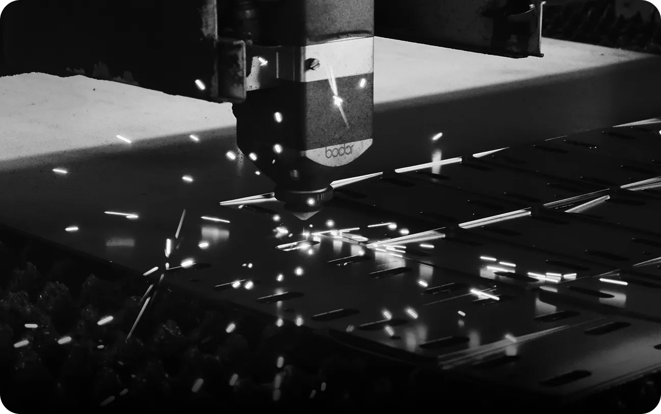 Aluminum fabrication machinery in action, enabling precision cutting for architectural systems.