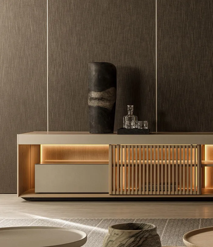 Contemporary low console unit with warm backlighting, slatted sliding doors, and matte lacquer finish.