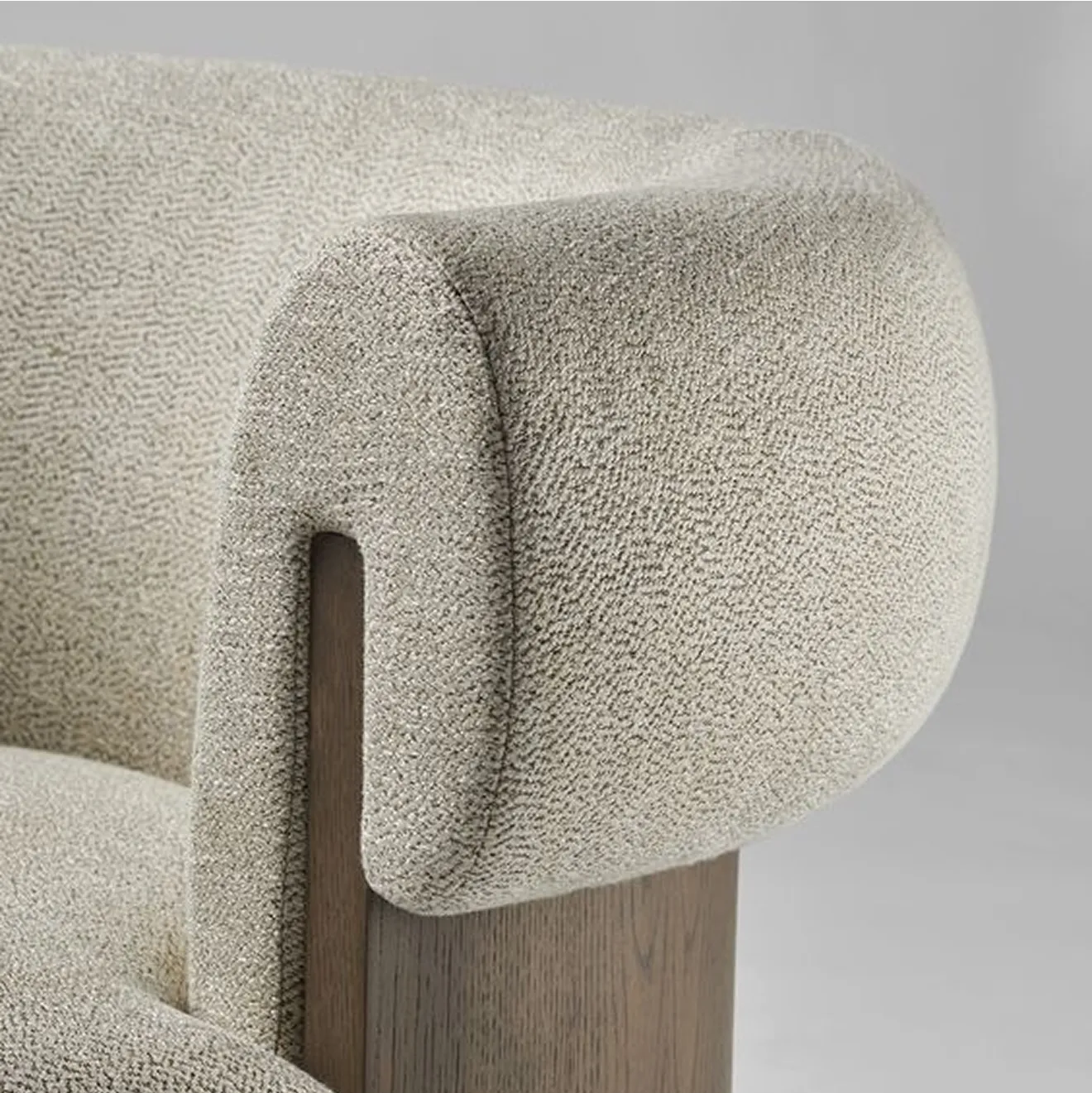Closeup of a custom designed armchair showcasing stitching and textiles