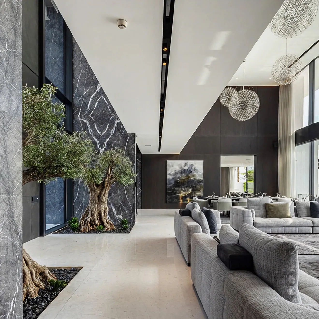 Spacious living area in a luxury villa featuring indoor trees