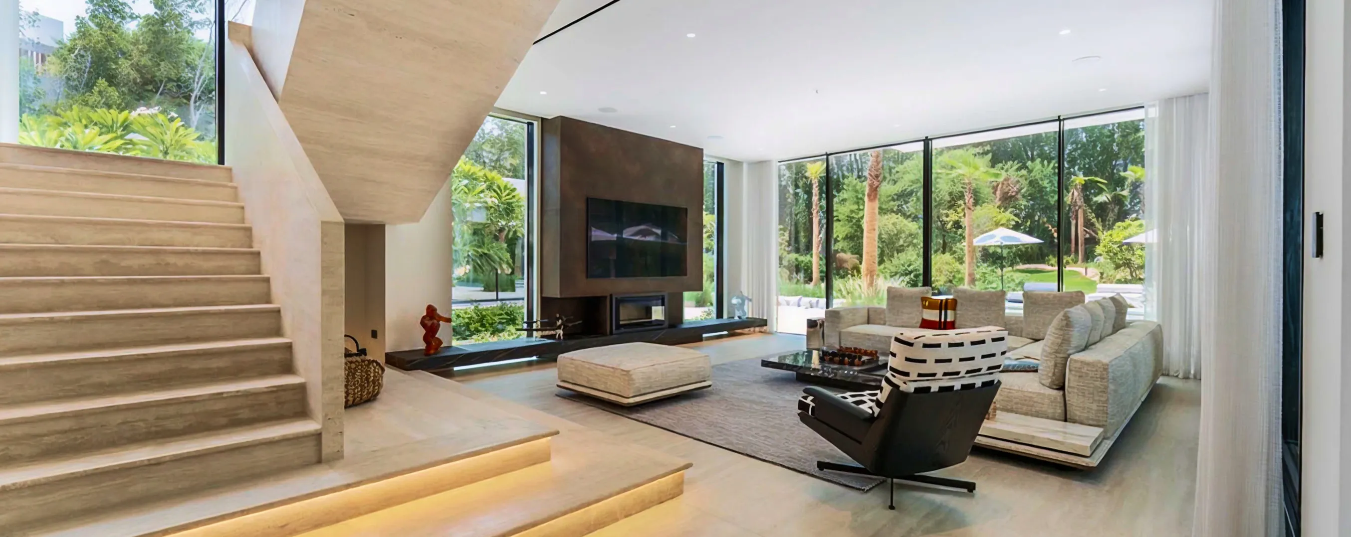 Modern villa interior design with floor to ceiling glass panels