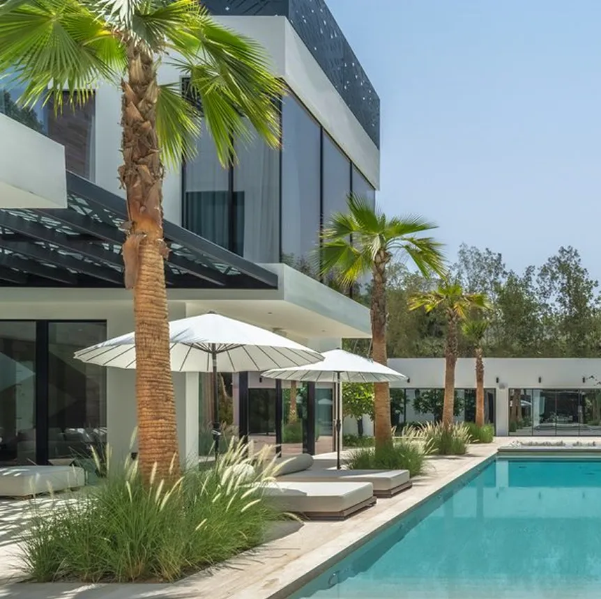 Luxury villa interior design featuring in built pool and lush greenery