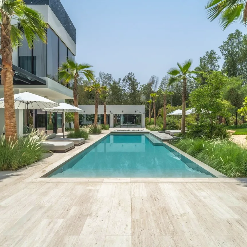 Luxury villa interior design featuring in built pool and lush greenery