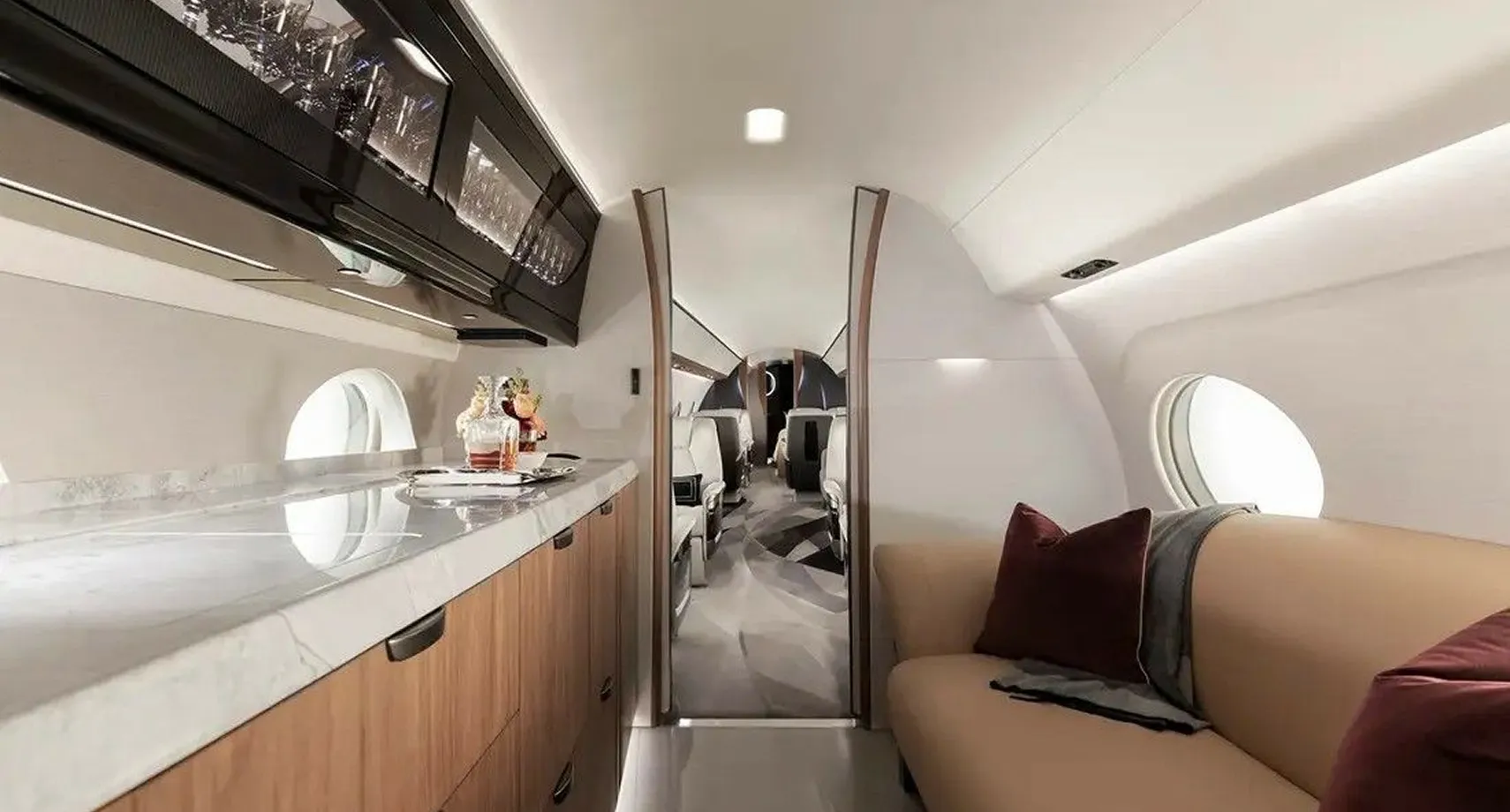 Concealed door integrated into the cabin wall in a private jet interior design