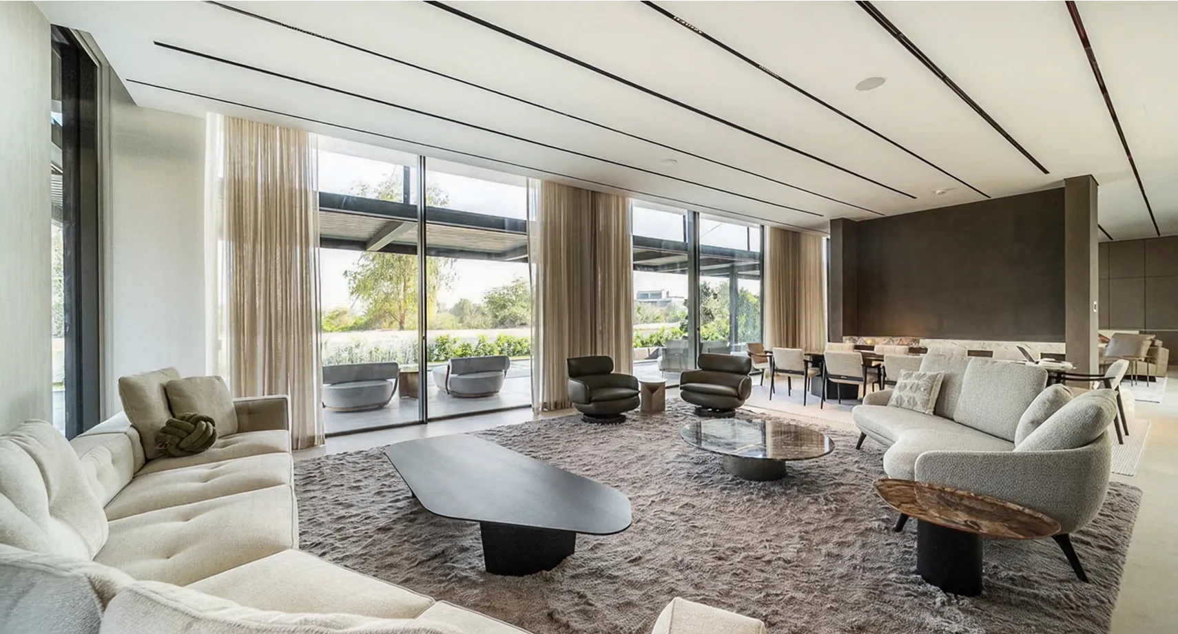 Spacious modern living room with floor-to-ceiling windows