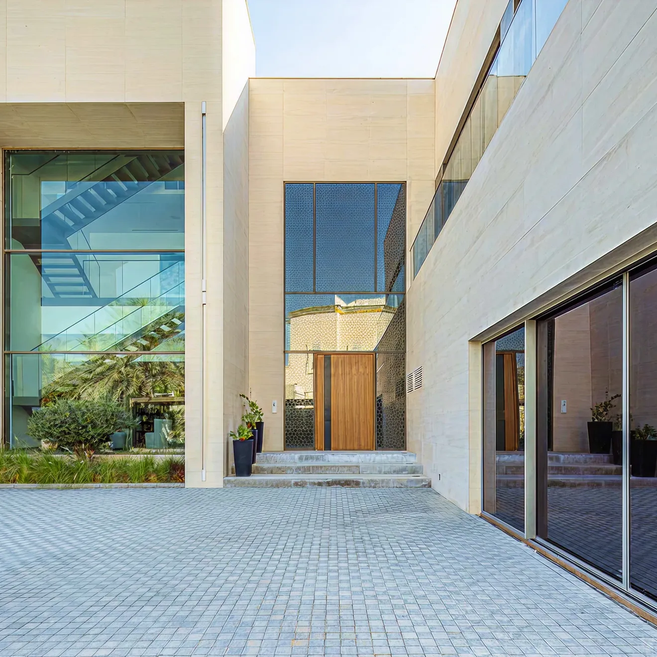 Luxury villa featuring floor to ceiling glass