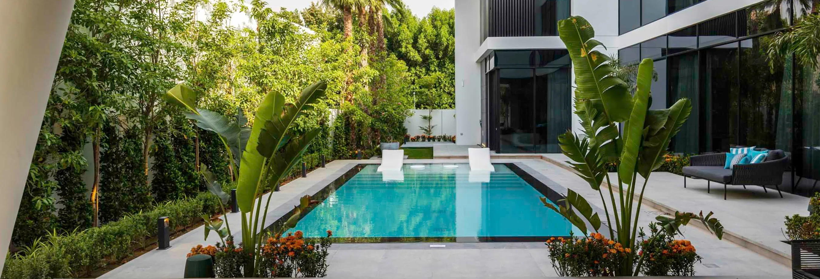 Luxury villa in Al Barari renovated by Rayfitout featuring a built-in infinity pool and bespoke landscaping