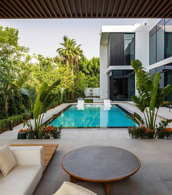 Luxury villa in Al Barari renovated by Rayfitout featuring a built-in infinity pool and bespoke landscaping
