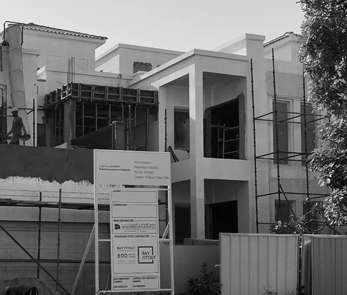 Board with permit information displayed at the villa renovation site