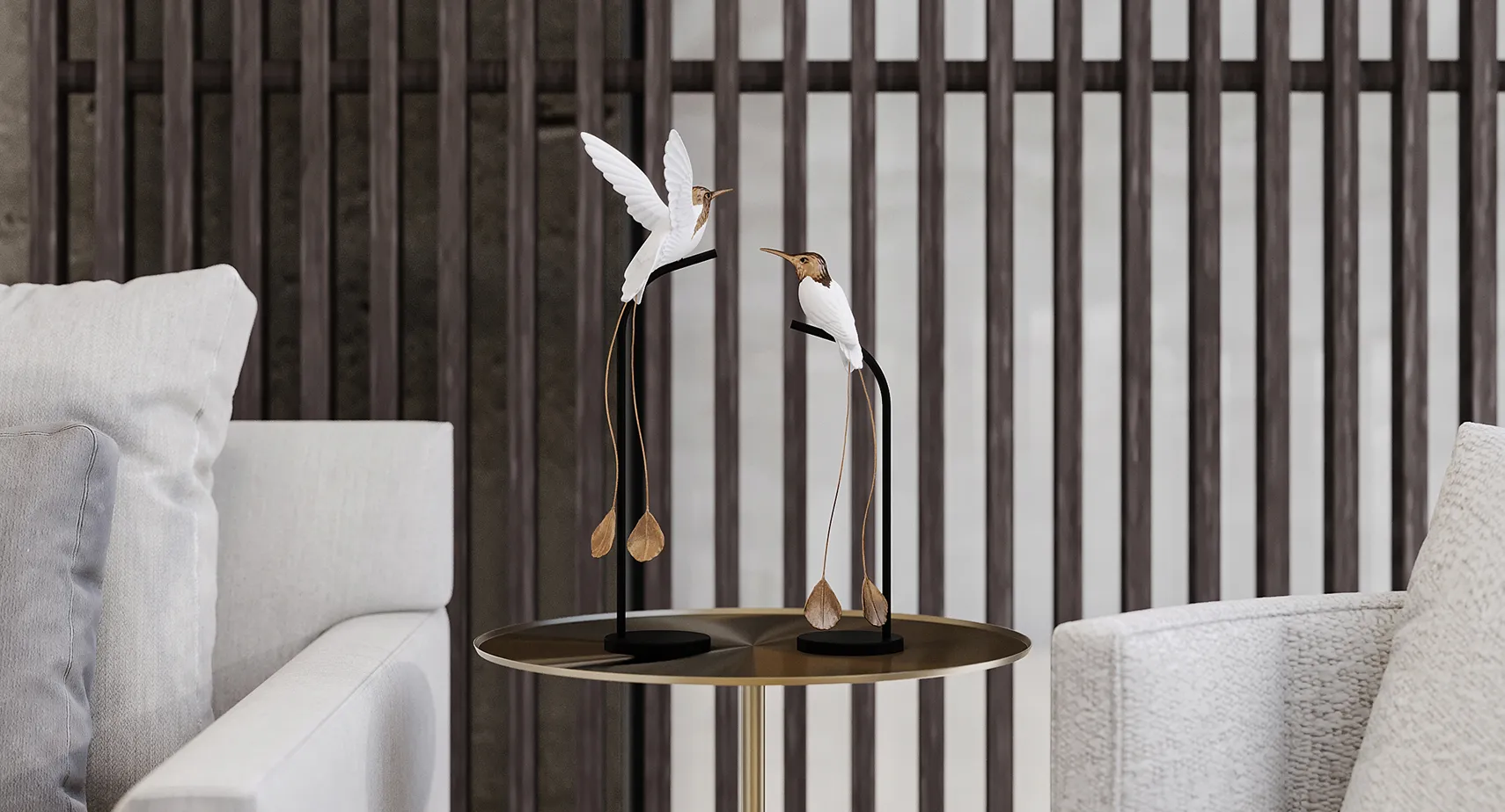 Decorative bird sculptures displayed on a metallic round table