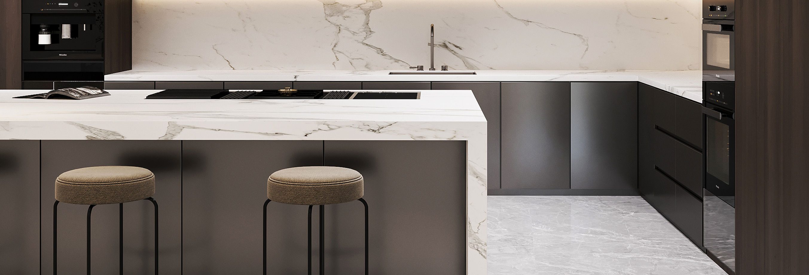 Modern kitchen interior design featuring a marble-patterned quartz island with a sink and bar stools, custom cabinetry, and integrated appliances