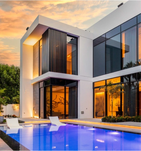 Elegant living room design with a marble coffee table, winged figure art on a wooden wall, and a chandelier