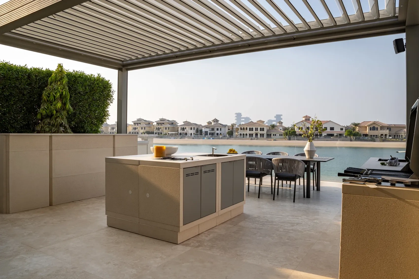 Contemporary living room with plush seating, floor-to-ceiling windows, and a striking chandelier