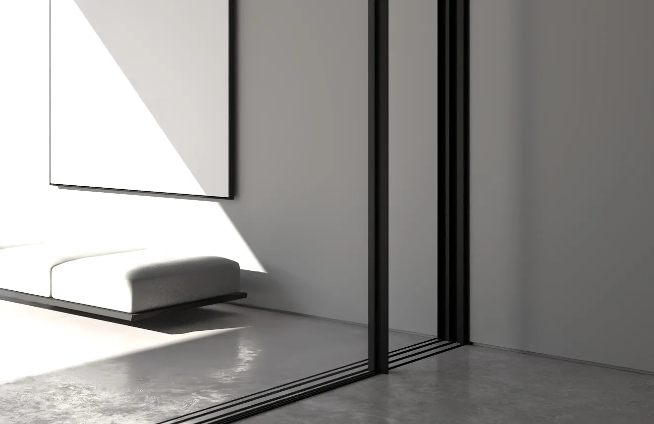 Modern villa entrance with minimalist architecture large glass panels, natural stone cladding, and a narrow water feature flanking a concrete pathway and a bonsai tree