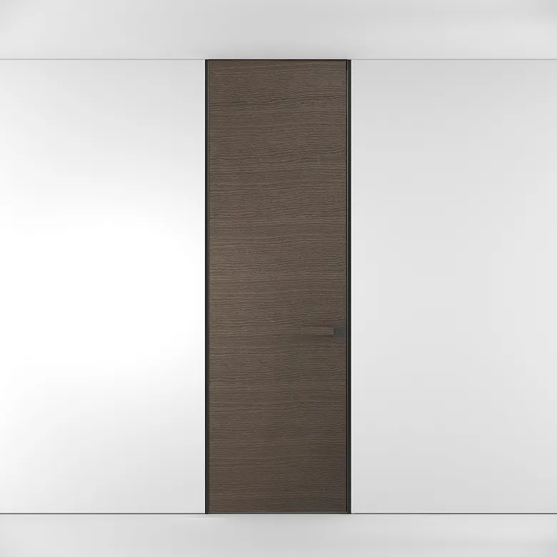 Close-up of a sleek silver door handle on a ceramic-finish concealed door.