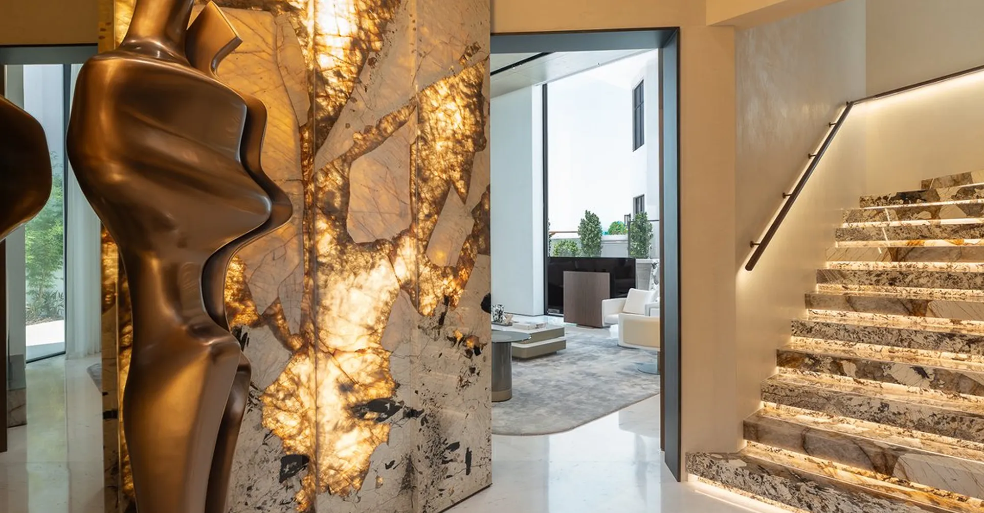 Luxury villa hallway in Abu Dhabi featuring contemporary interior design featuring an illuminated staircase.