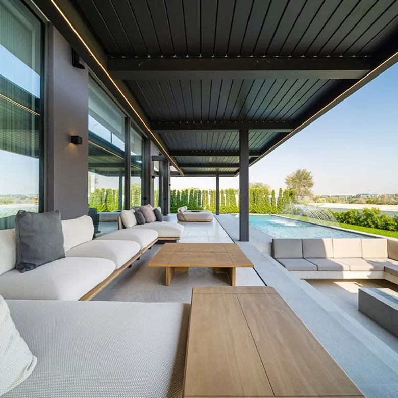 Luxury villa landscape design in Abu Dhabi with custom seating and a poolside garden.