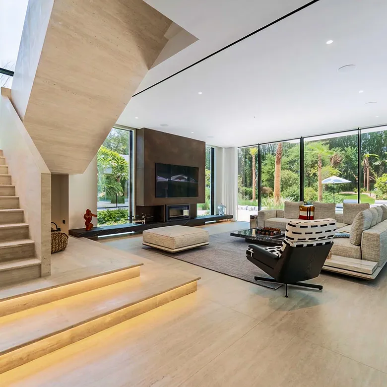 Contemporary villa interior design in Abu Dhabi with floor-to-ceiling windows and custom furniture.