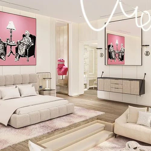 Modern bedroom interior design featuring pop art paintings and a seating area.