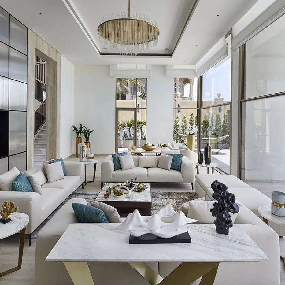 Modern apartment living room interior design featuring floor-to-ceiling windows and city skyline view.