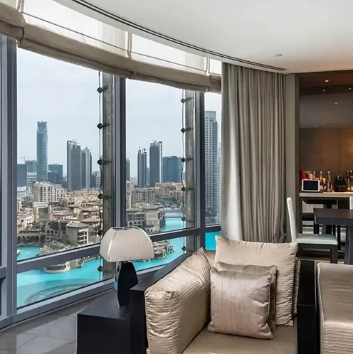 Open plan dining and living area interior design featuring bespoke joinery in Dubai.