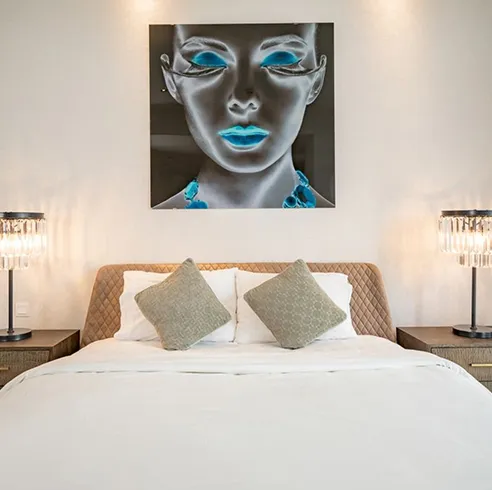 Modern living room interior design with double-height ceilings and expansive windows featuring luxury interior design.