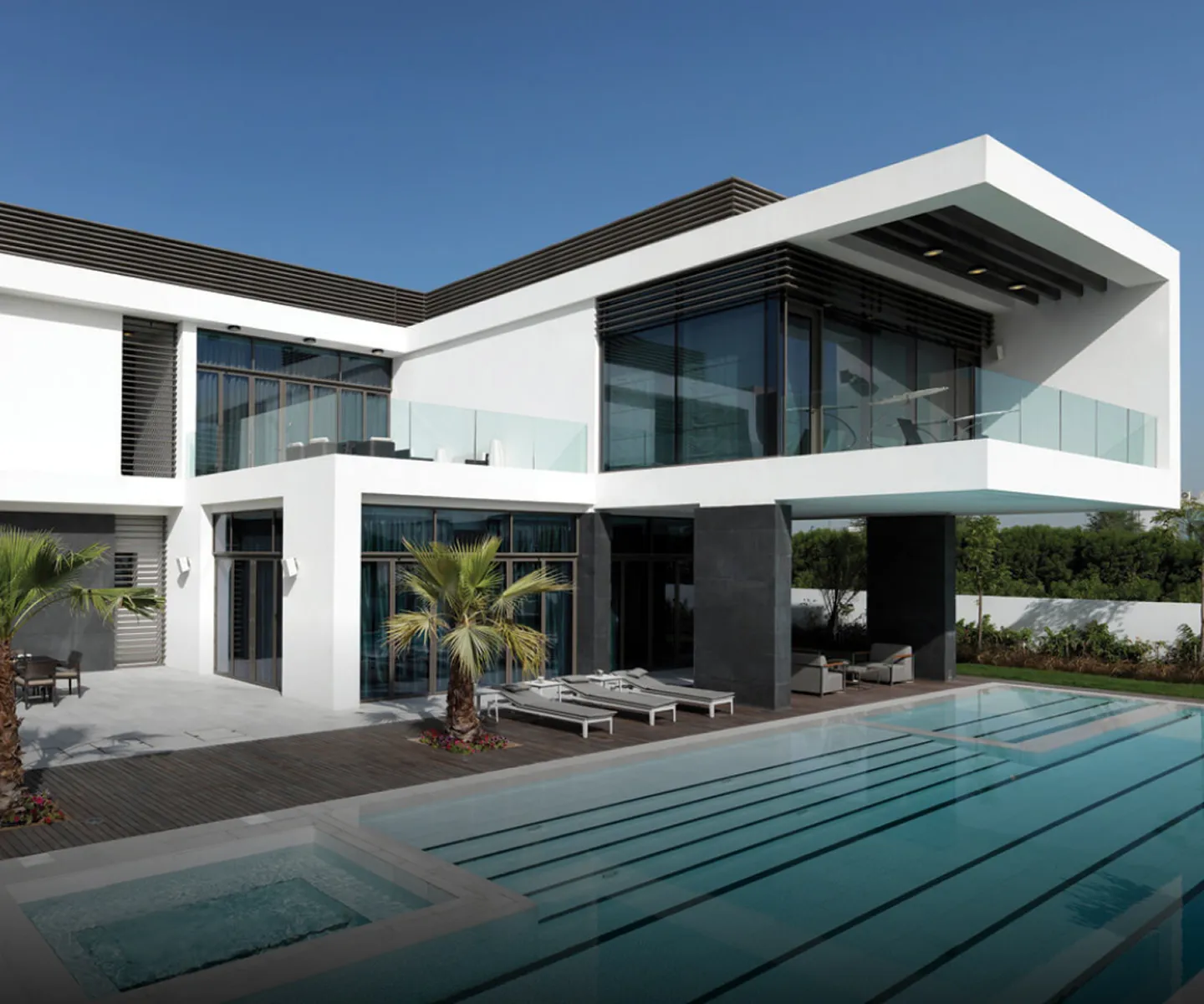 Luxury villa featuring an infinity pool and custom landscaping.