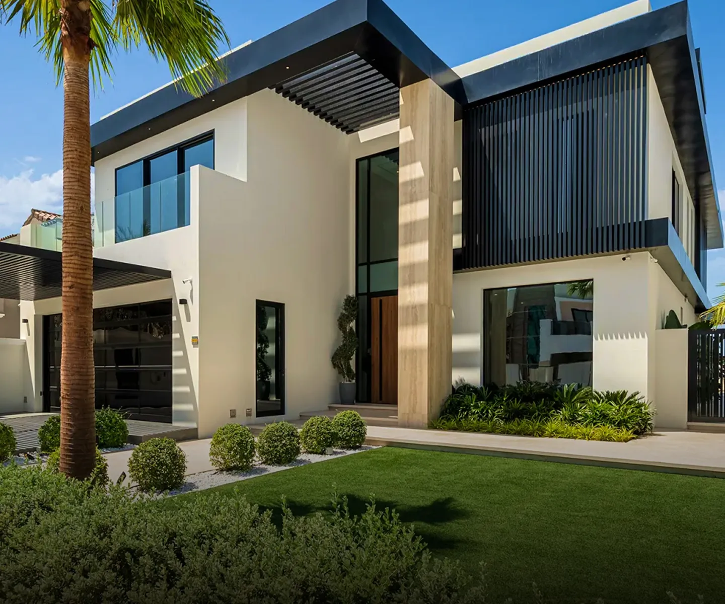 Luxury villa featuring an infinity pool and custom landscaping.