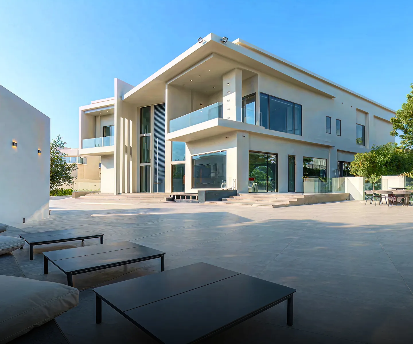 Luxury interior design with modular seating and floor-to-ceiling windows.