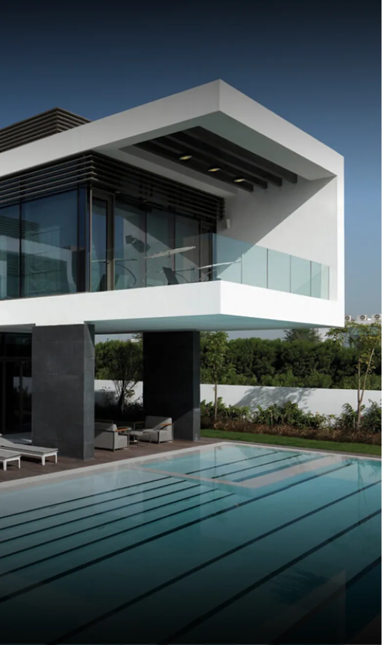 Modern beachfront villa with expansive windows in Abu Dhabi.