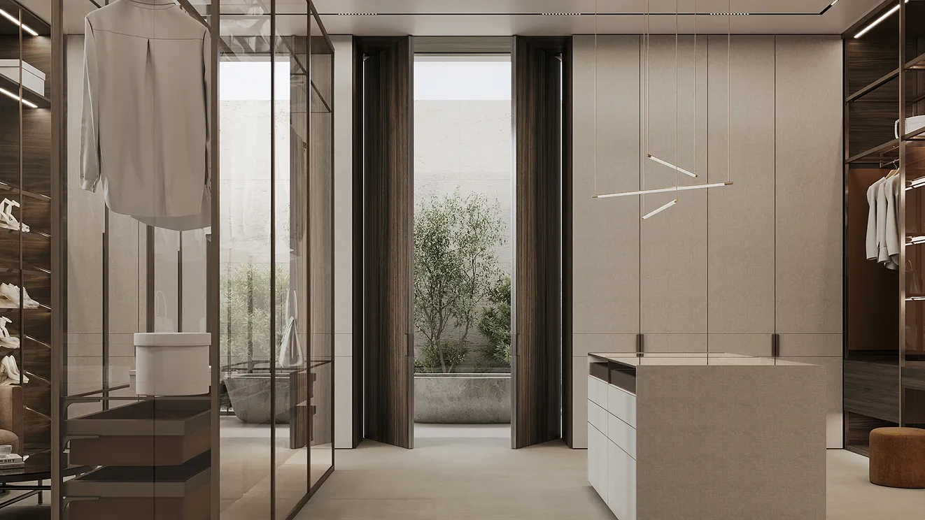 Luxurious walk-in closet with open and closed storage sections.