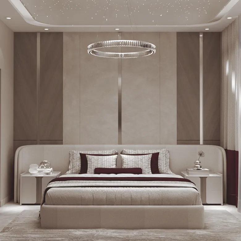 Luxury bedroom interior design featuring a crystal chandelier and panelled wall.