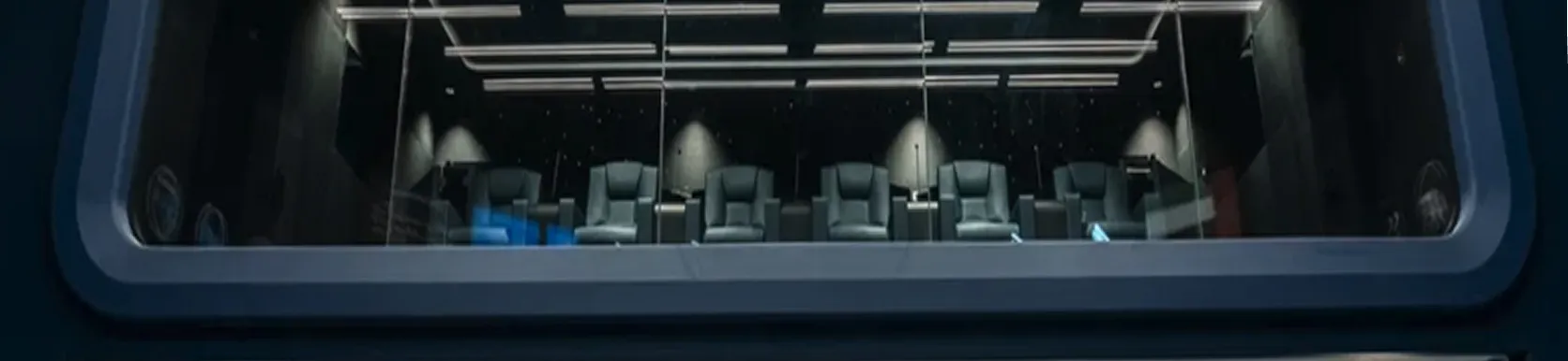 Theatre interior with reclining seats and starlight ceiling from a top interior fit out company in Dubai.