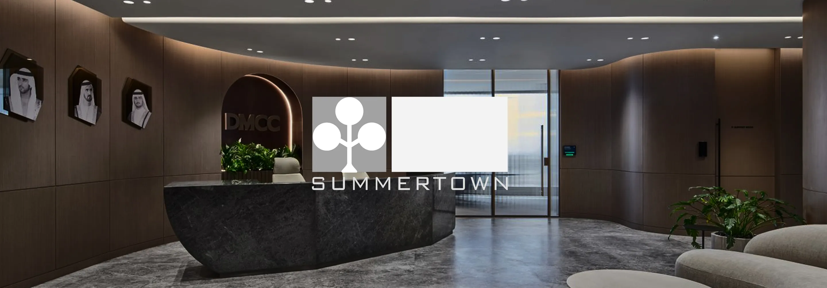 Modern executive lobby with wood panelled walls by a top interior fit out company.