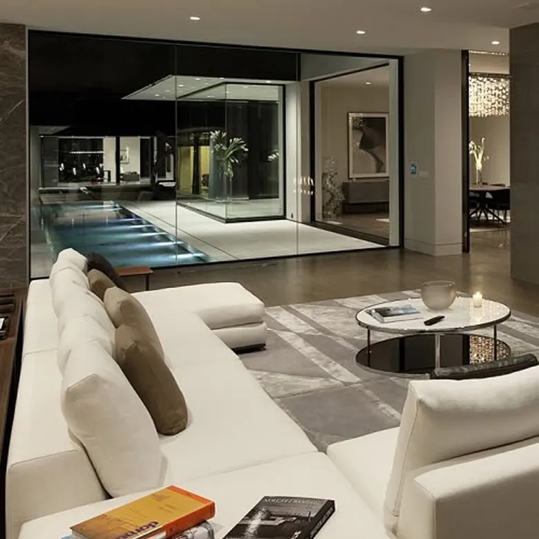 Contemporary villa design featuring a marble table and floor-to-ceiling windows in Dubai.