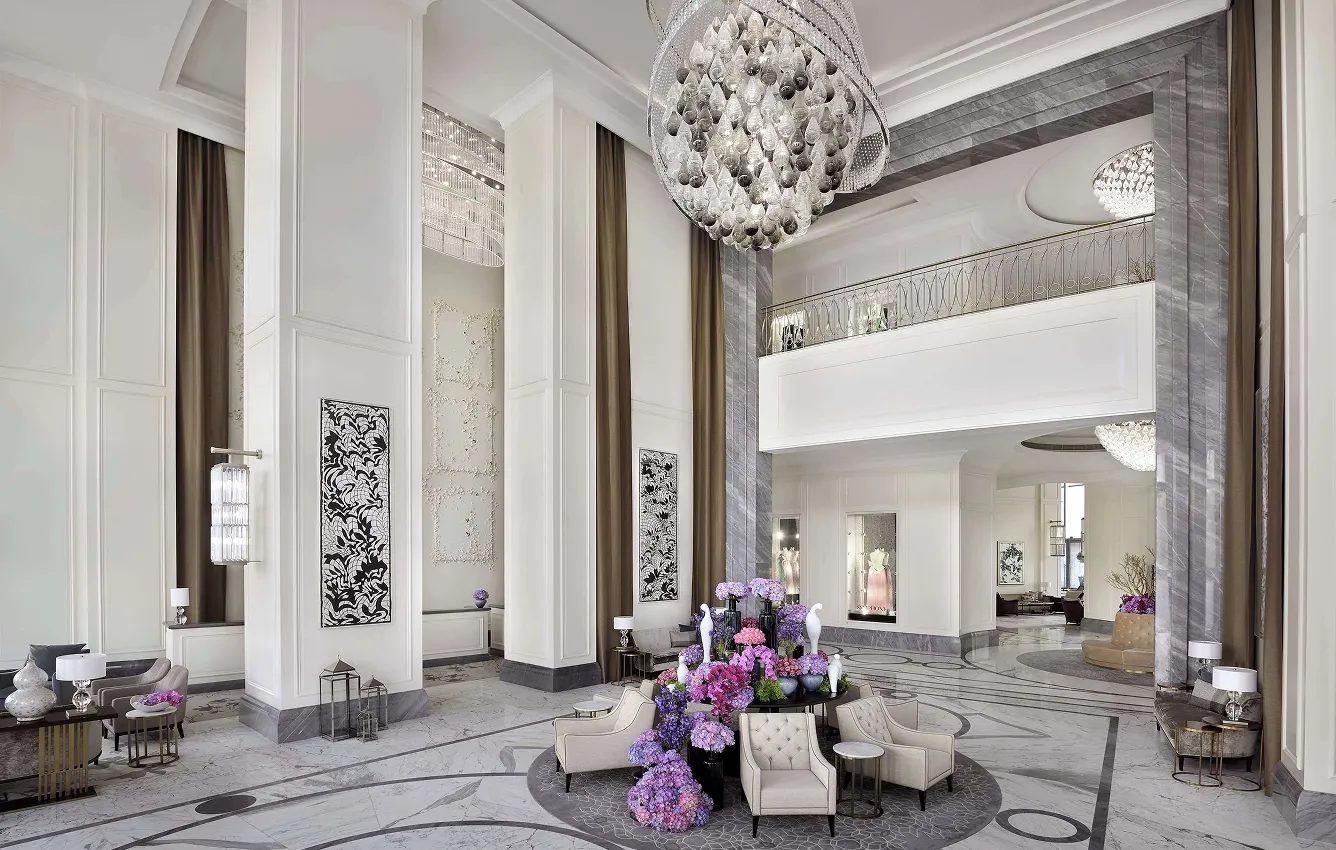Luxury hotel lobby interior design with marble and chandelier.