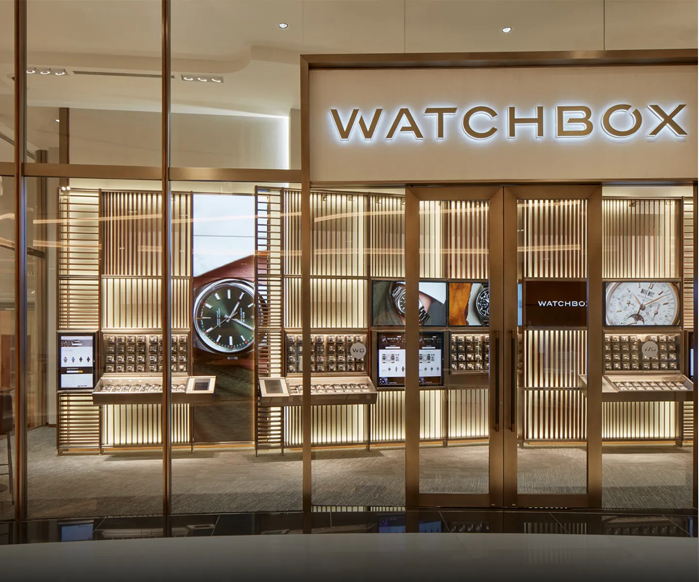 Commercial Interior Design of WatchBox store with illuminated luxury displays in Dubai.