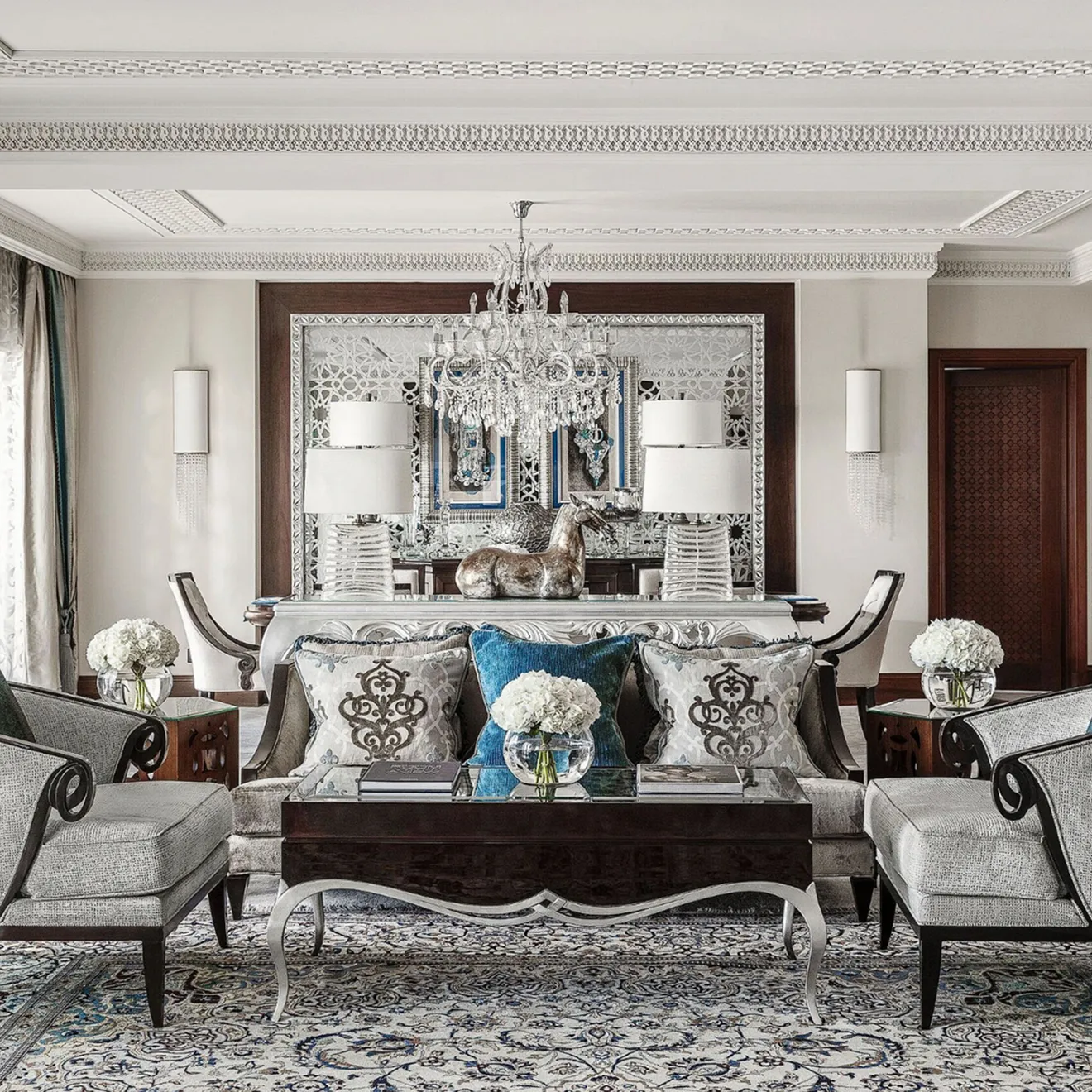 Luxury hospitality interior design featuring modern furniture and chandelier in Dubai.