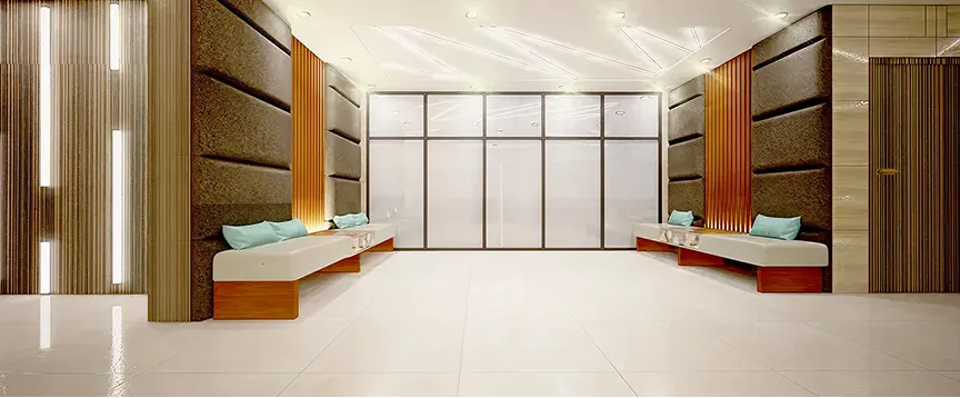 Hospitality interior design featuring a minimalist lobby with padded panels and benches.