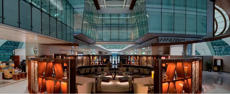 Modern hospitality interior design featuring a multi-level airport business lounge.