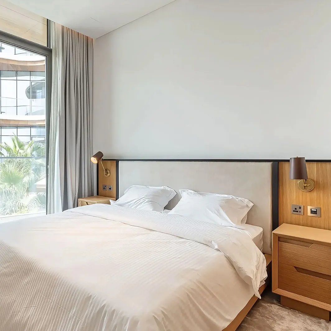 Luxury bedroom interior design in Dubai featuring floor-to-ceiling windows by Rayfitout.