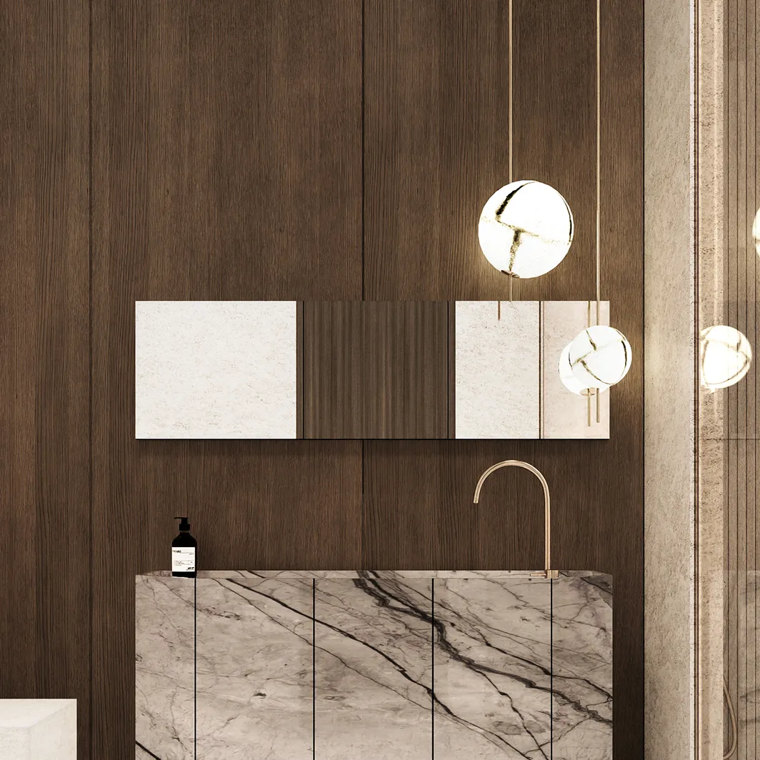 Modern vanity featuring dark wood panels, marble countertop, and gold faucet.