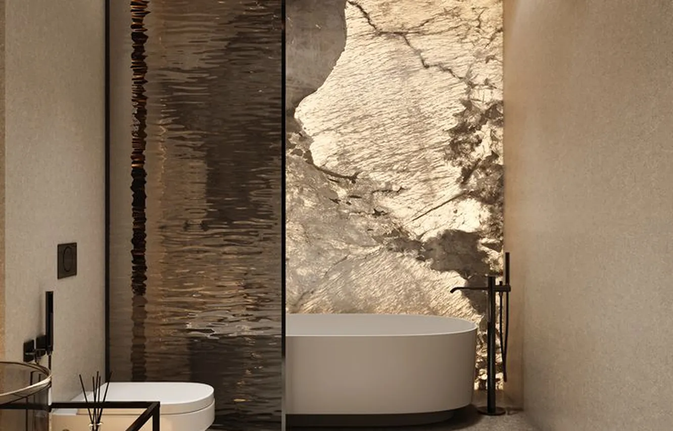 Modern bath featuring a stone feature wall and glass shower partition in a luxury villa.