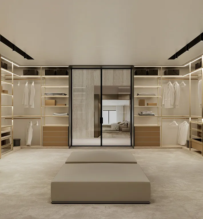 Contemporary walk-in wardrobe with illuminated shelves and integrated lighting.